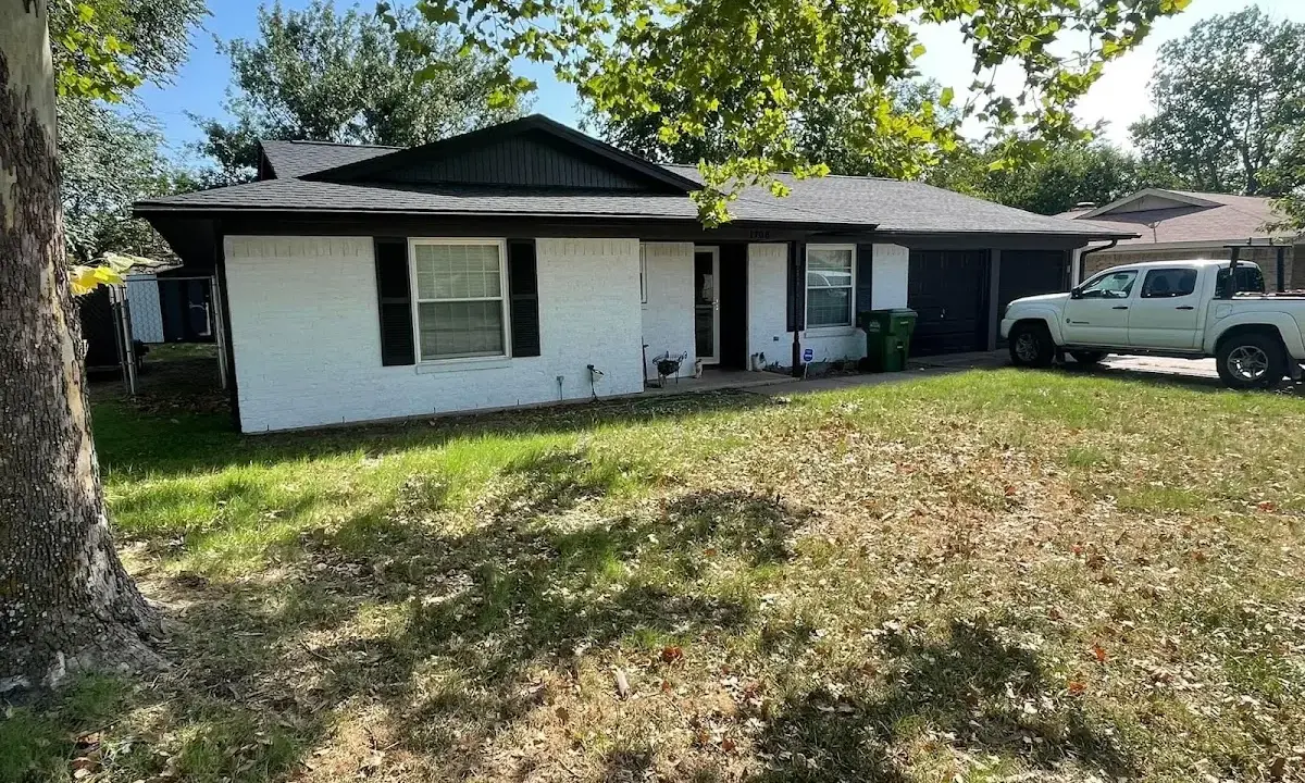 Professional roofing crew working on a residential roof in Kenilworth